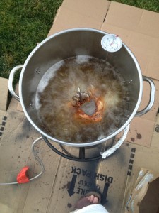 Deep fried in peanut oil after a 3-day dry brine in salt, pepper, and lemon zest